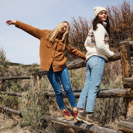 Free Country jackets worn by hikers in a remote mountain landscape — built for comfort, durability, and outdoor exploration