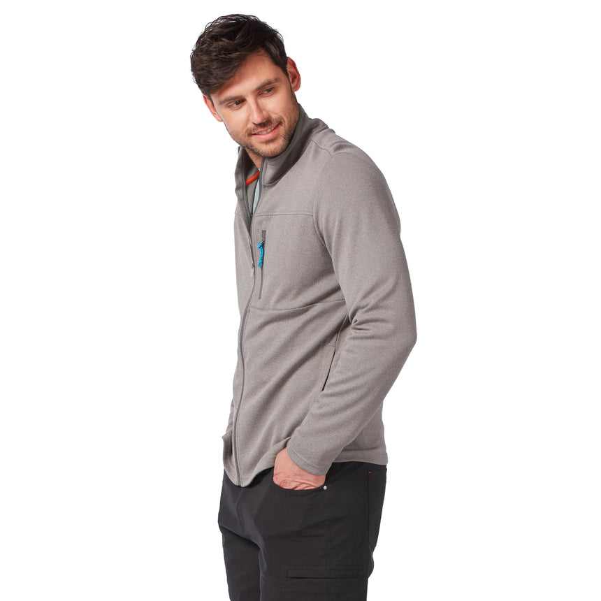 Man wearing a grey Men’s FreeCycle® Double Knit Full Zip Fleece Jacket with a small zippered chest pocket, looking to the side with his hands in his pockets.
