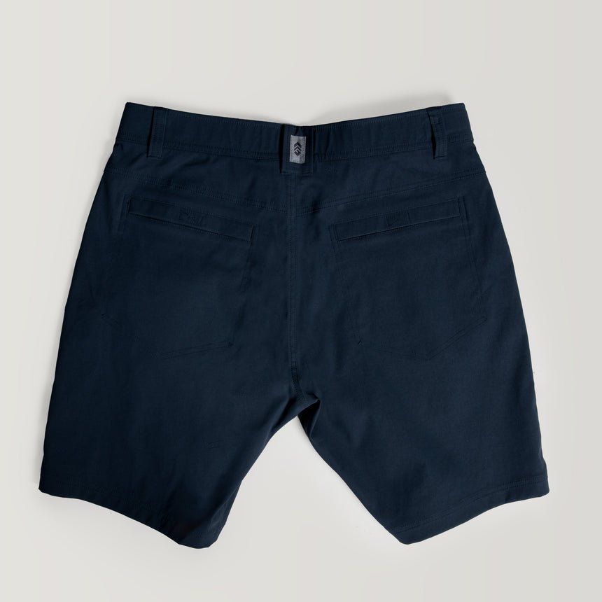 Free Country Men's Nylon Stretch Trek Short in Steel, size M, made from lightweight stretch performance fabric featuring a water repellent finish, an adjustable waist belt, two back welt pockets, and two side sipper pockets #color_steel