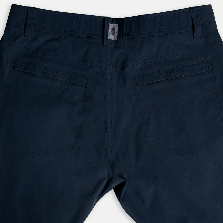 Free Country Men's Nylon Stretch Trek Short in Steel, size M, made from lightweight stretch performance fabric featuring a water repellent finish, an adjustable waist belt, two back welt pockets, and two side sipper pockets #color_steel