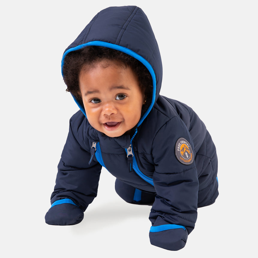 Free Country Kids' Infant Lightweight Quilted Puffer Snow Suit in navy, featuring wide channel quilting, sherpa lining, dual zippers, and fold-over mittens and booties for warmth and easy dressing.
