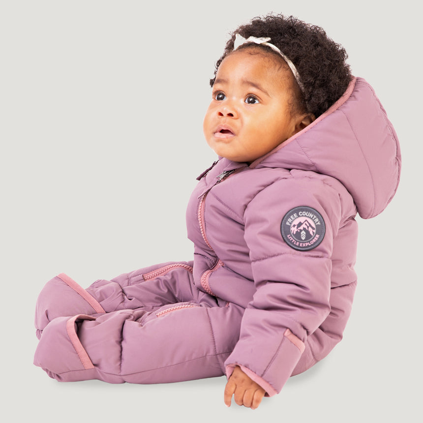 Free Country Kids' Infant Lightweight Quilted Puffer Snow Suit in light purple, featuring wide channel quilting, sherpa lining, dual zippers, and fold-over mittens and booties for warmth and easy dressing.