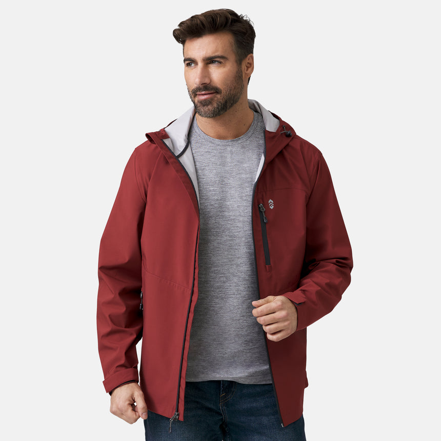 A man with brown hair and a beard wears the Clearance Men's Hydro Lite X2O Highline Waterproof Jacket in maroon over a gray shirt and blue jeans, looking to the side and holding his open jacket against a plain white background.