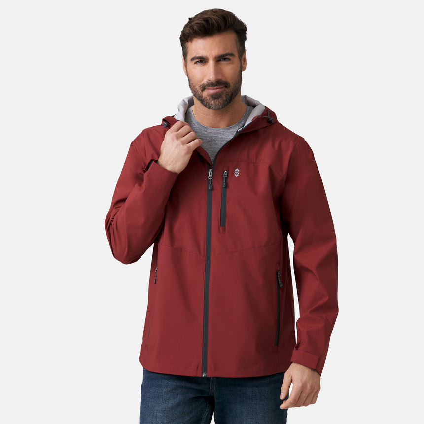A man with short brown hair and a beard wears the Clearance Men's Hydro Lite X2O Highline Waterproof Jacket in maroon over a gray shirt, standing against a plain light background with one hand touching the collar.