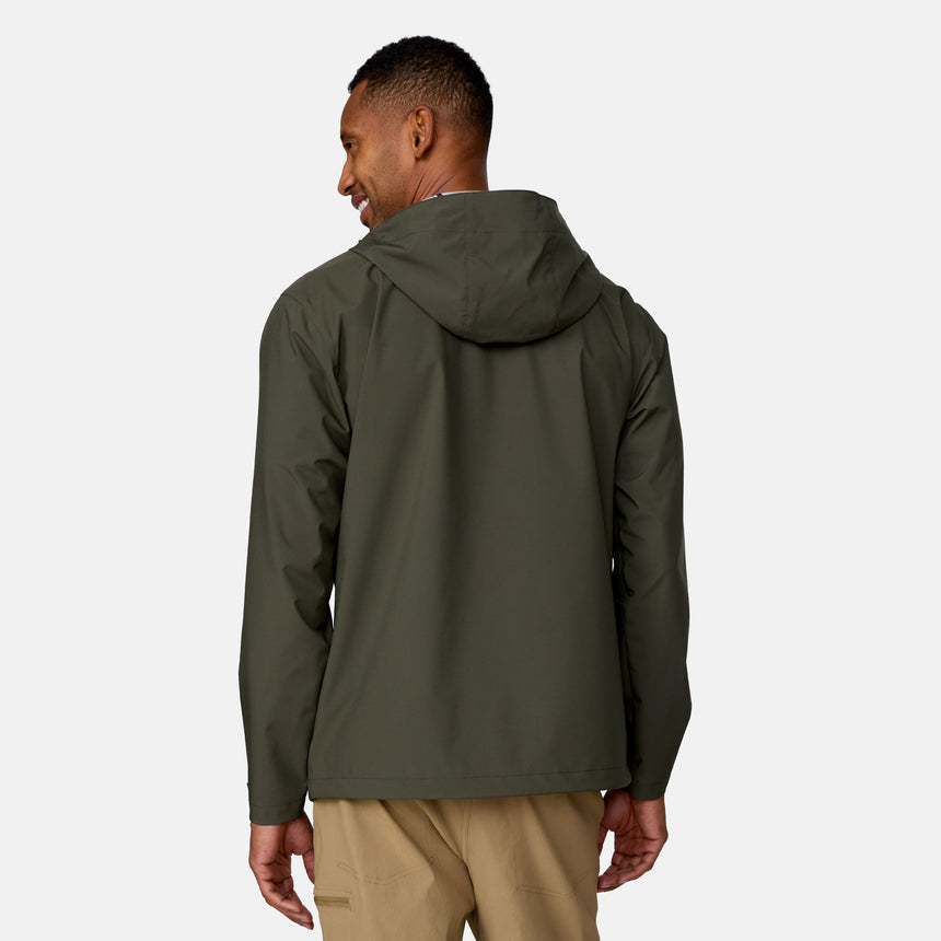 A man faces away, smiling over his left shoulder, wearing the Clearance Men's Hydro Lite X2O Highline Waterproof Jacket in olive green and tan pants. The background is plain white.