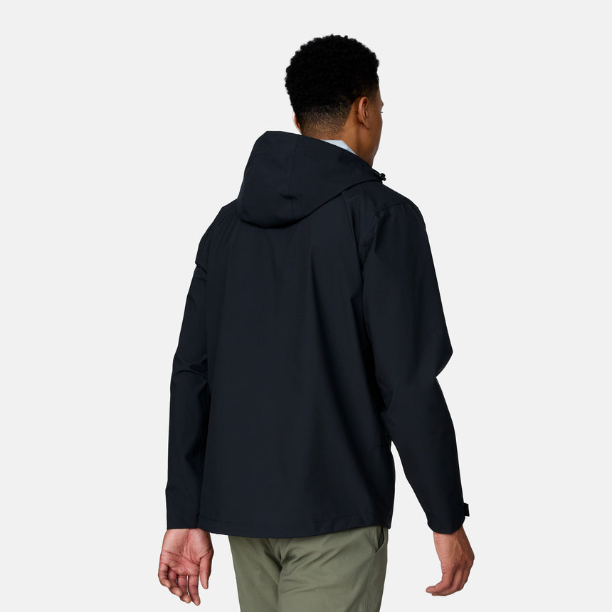 A person is shown from the back wearing the Clearance Men's Hydro Lite X2O Squall Rain Jacket in black with a hood and olive green pants, standing against a plain light gray background.