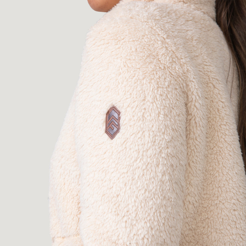Woman wearing Free Country Women's Sherpa Butter Pile® Button Front Jacket in white  with a full front button opening, stand collar, lower pockets, and soft butter pile fabric. light grey background. Perfect women’s jacket for fall weather.