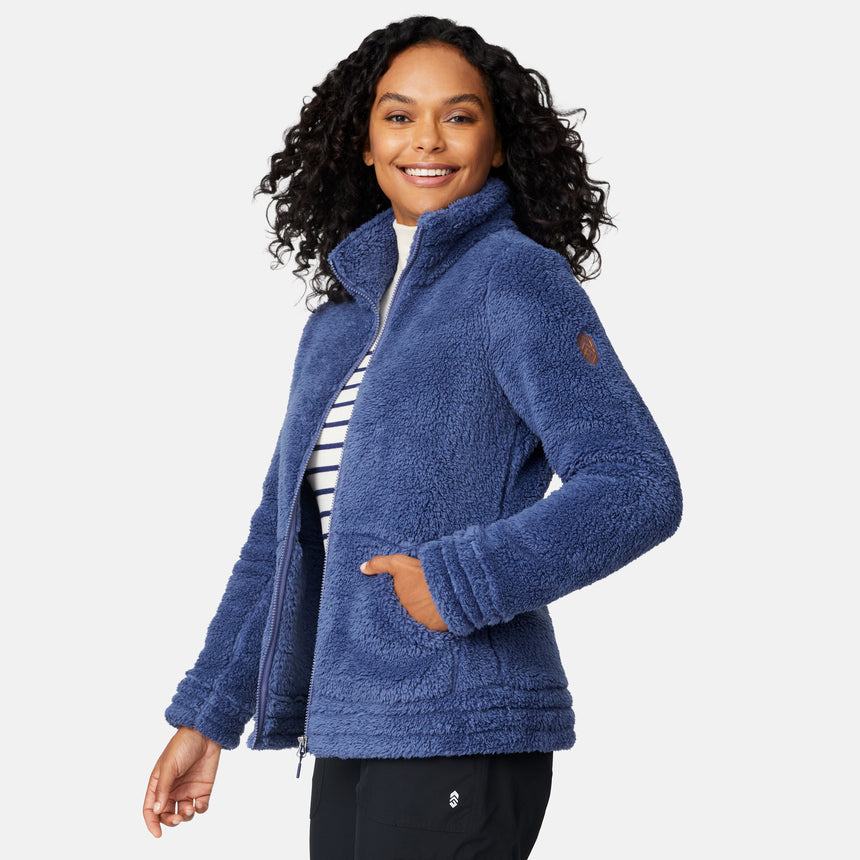Woman wearing a blue fleece jacket on a white background