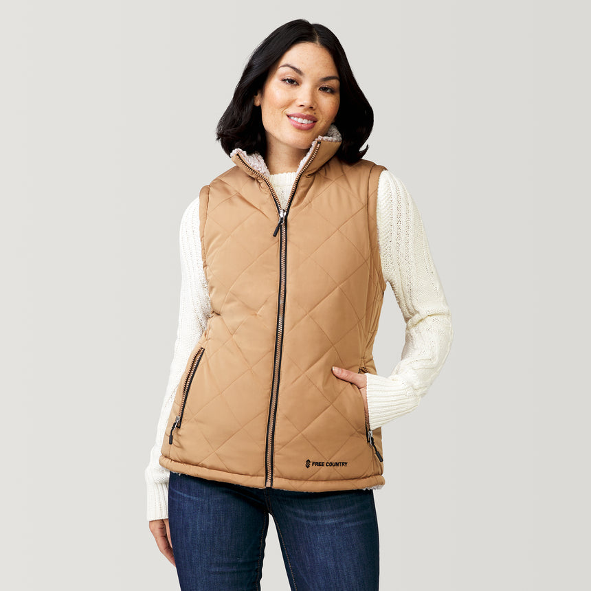 [Megan is 5'6" wearing a size Small.] Women's Expedition Stratus Lite Reversible Vest - Camel - S #color_camel