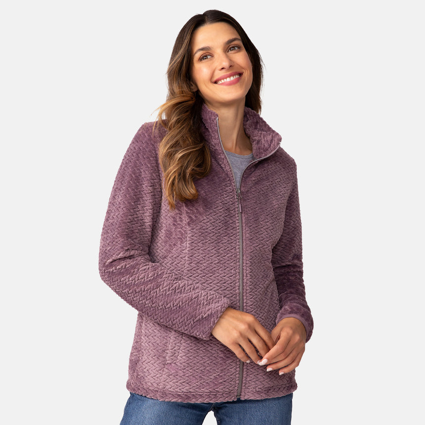 A woman wearing a Plumberry Women’s Cable Braided Butter Pile® Jacket, a super soft, zip-up, cable-braided style.