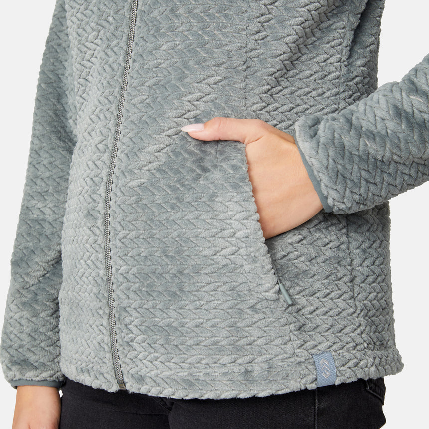 Close-up of a gray Women’s Cable Braided Butter Pile® Jacket showing a textured, braided pattern and a hand resting in the side pocket.