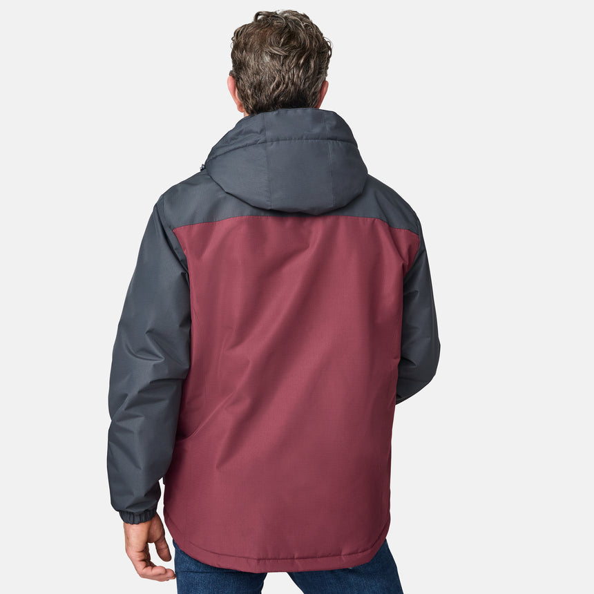 A man with short brown hair is seen from behind, wearing the Clearance Men's Arvon Insulated Jacket in maroon and dark gray with blue jeans against a plain white background.