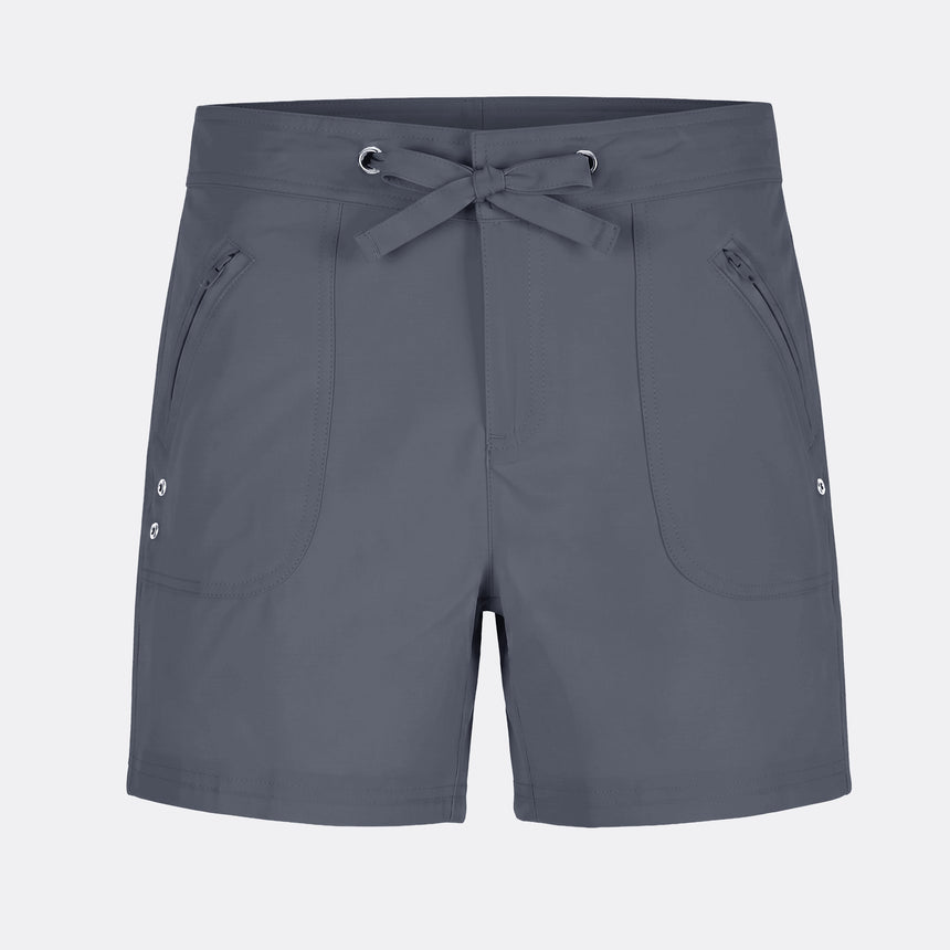 The Free Country Women's 5" Bermuda Board Short in dark gray features a drawstring waistband, zippered front pockets, a small logo near the left hem, four-way stretch fabric for comfort, and quick-drying material.