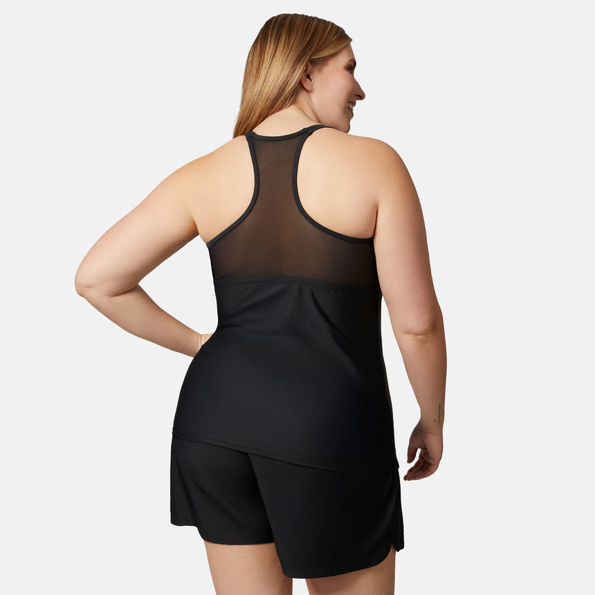 A woman with long light brown hair stands with her back to the camera, wearing the Clearance Women’s Plus Size Tango Mesh Zip Up Racerback Tankini Top in black, paired with matching shorts, against a plain white background.