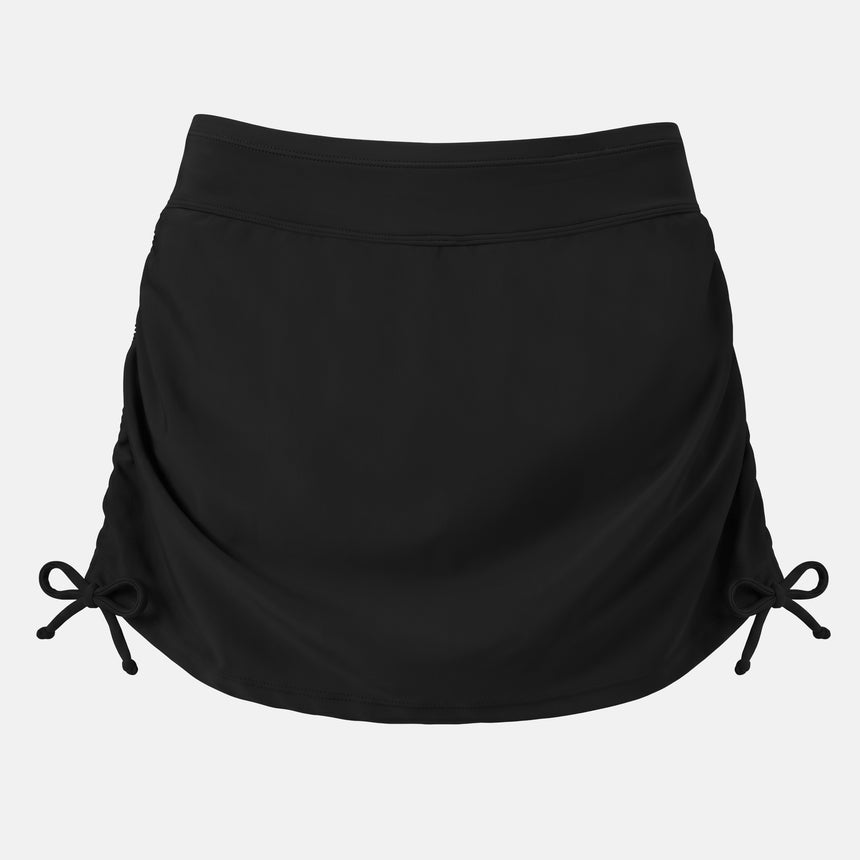 The Free Country Women's Side Shirred Swim Skirt in black features adjustable side ties, a wide waistband, and a built-in brief, shown against a white background.