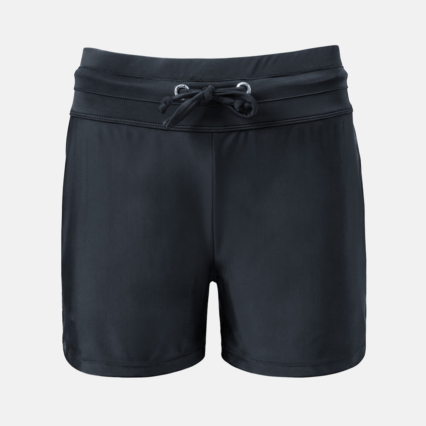 The Free Country Women's Drawstring Swim Short is a pair of black quick-dry athletic shorts with an elastic waistband, adjustable drawstring, and a small reflective logo on the lower left leg, shown on a plain white background.