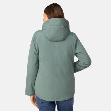 A person with long brown hair, seen from behind, wears the Clearance Women's Cascade Canvas 3-in-1 Systems Jacket in sage green with blue jeans against a plain light gray background.