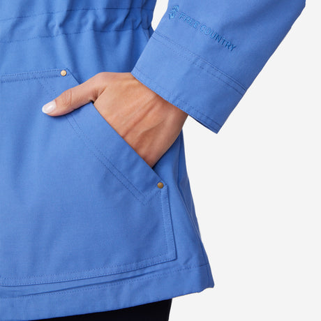 A person wears the Clearance Women's Lightweight Cascade Canvas Jacket in light blue, with their left hand in a front pocket, against a plain white background.