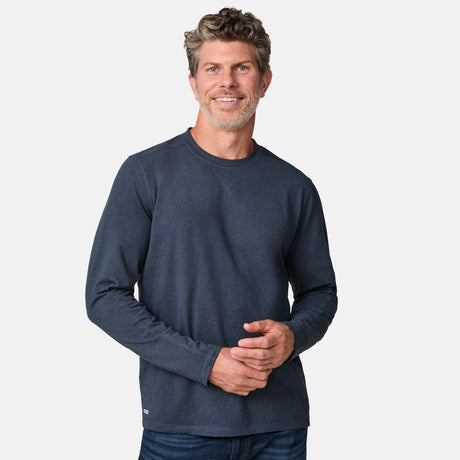 [Kolby is 6'2" wearing size M.] Man wearing a navy long-sleeve shirt on a white background