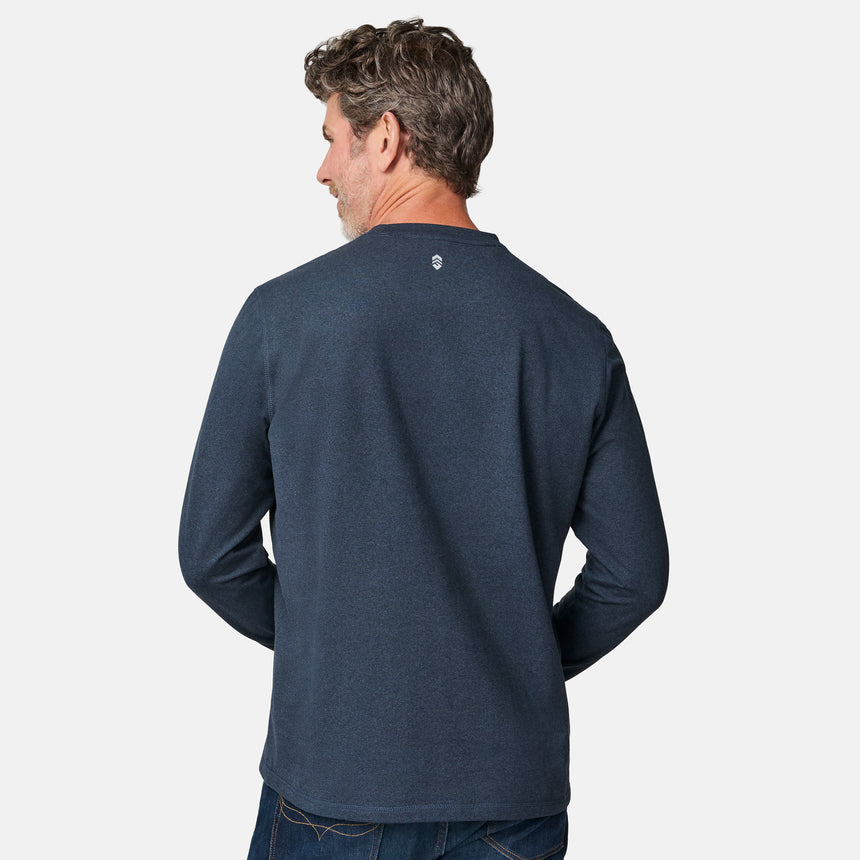 [Kolby is 6'2" wearing size M.] Man wearing a navy long-sleeve shirt on a white background