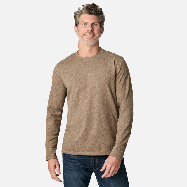 [Kolby is 6'2" wearing size M.] Man wearing a brown long-sleeve shirt on a white background