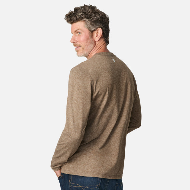 [Kolby is 6'2" wearing size M.] Man wearing a brown long-sleeve shirt on a white background