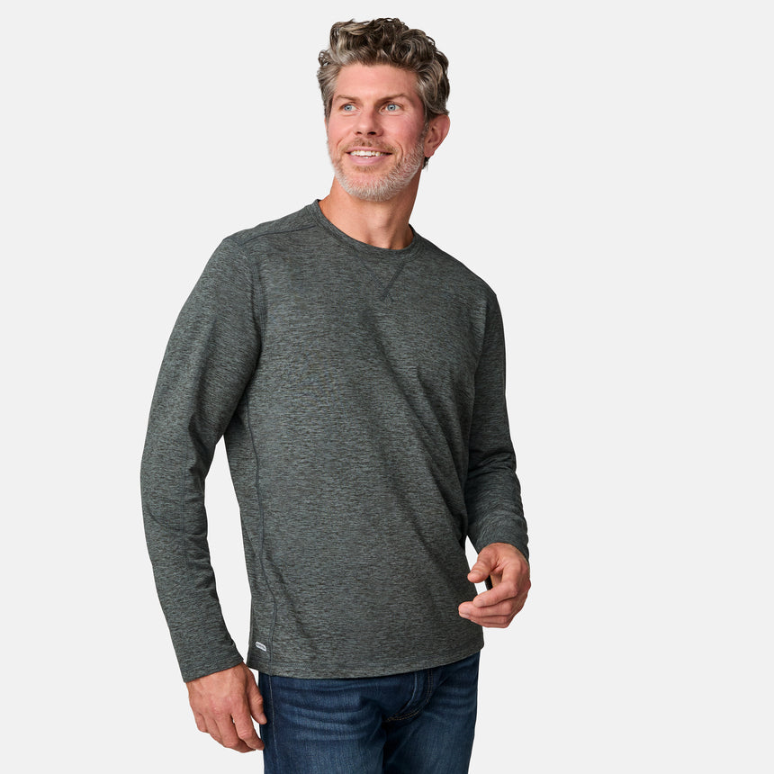 [Kolby is 6'2" wearing size M.] Man wearing a green long-sleeve shirt on a white background
