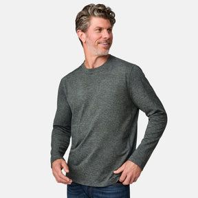 [Kolby is 6'2" wearing size M.] Man wearing a green long-sleeve shirt on a white background