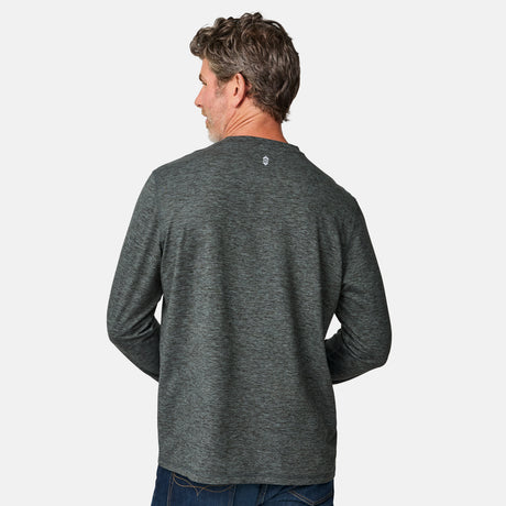 [Kolby is 6'2" wearing size M.] Man wearing a green long-sleeve shirt on a white background