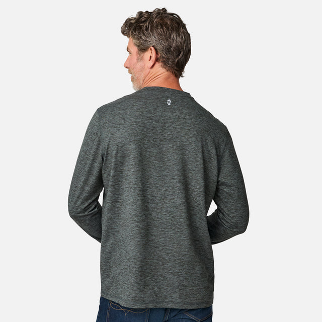 [Kolby is 6'2" wearing size M.] Man wearing a green long-sleeve shirt on a white background