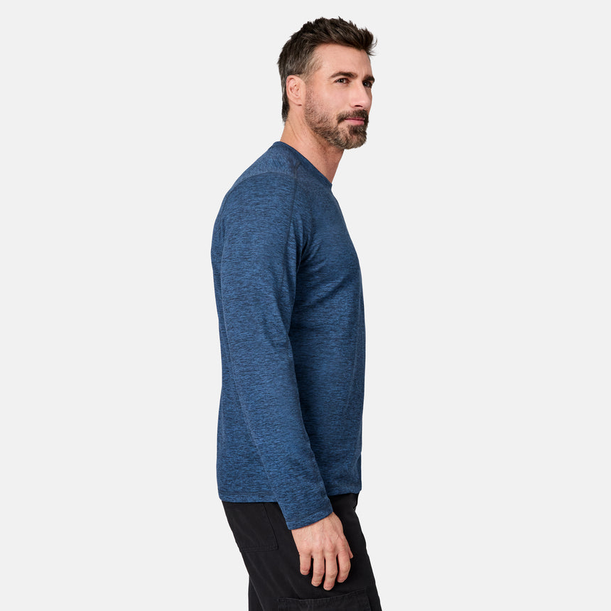 [Model is wearing size M.] A man in side profile wearing a heathered blue long-sleeve crewneck shirt and black pants, photographed against a clean light gray studio background.