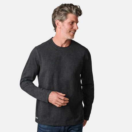 [Kolby is 6'2" wearing size M.] Man wearing a dark gray long-sleeve shirt on a white background