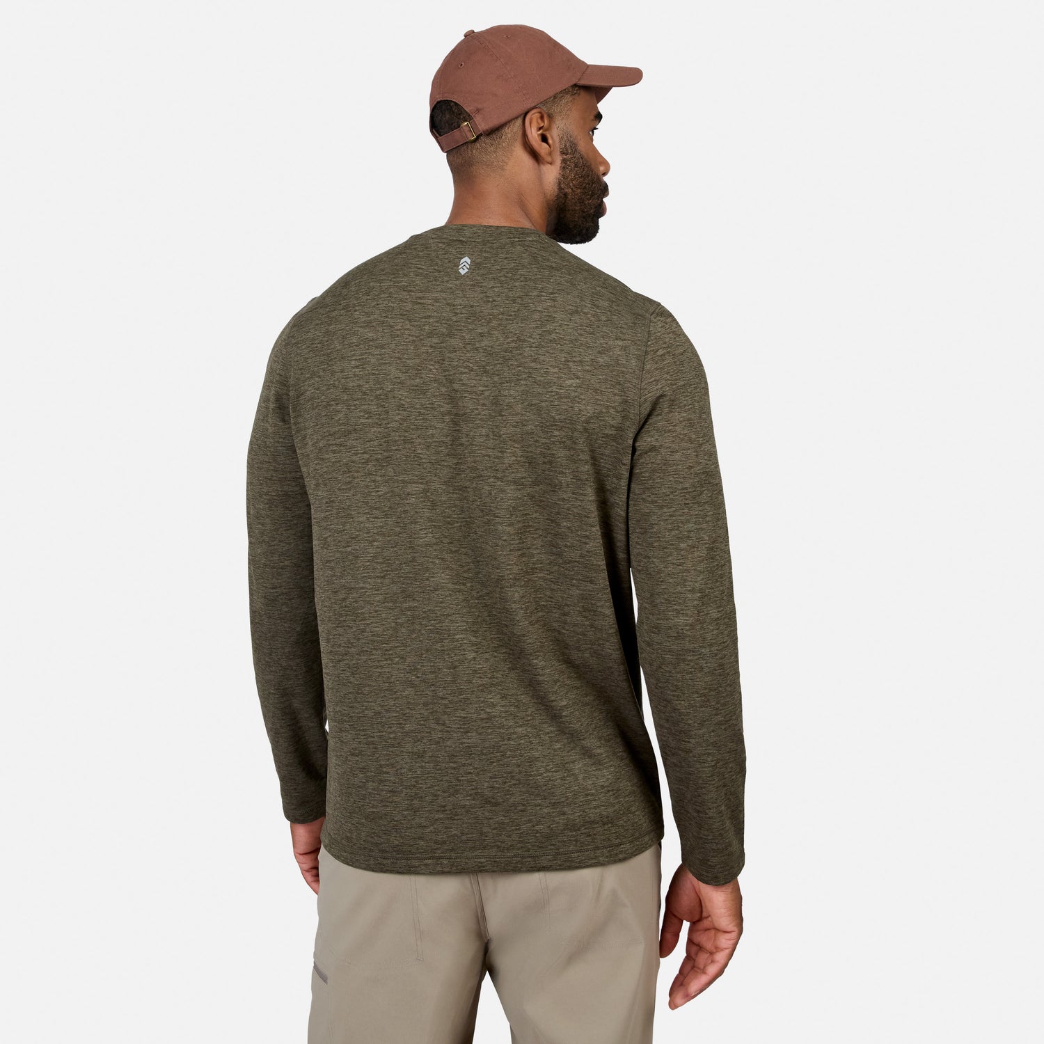 [Model is wearing size M.] A man shown from the back wearing a heathered olive green long-sleeve knit sweater, beige pants, and a brown baseball cap, against a light gray studio background.