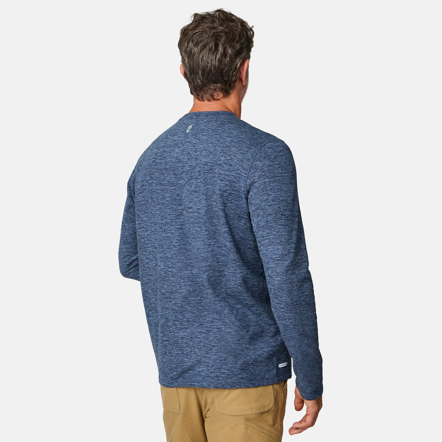 [Kolby is 6'2" wearing size M.] Man wearing a blue long-sleeve shirt on a white background
