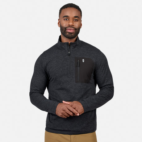 [Model is wearing size M.] A man wearing a dark heather gray quarter-zip pullover with a black chest pocket and zipper, paired with tan pants, against a light gray studio background.