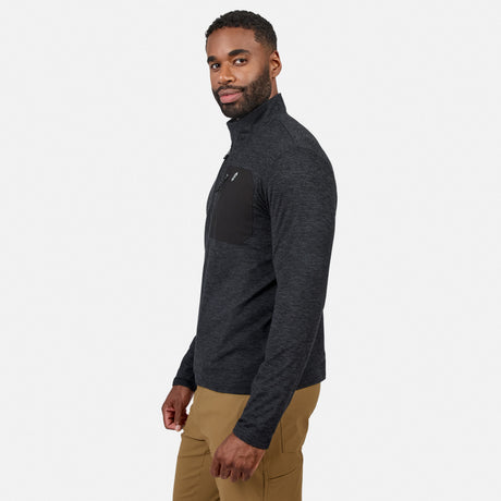 [Model is wearing size M.] A man wearing a dark heather gray quarter-zip pullover with a black chest pocket, paired with tan pants, shown in profile against a light gray studio background.