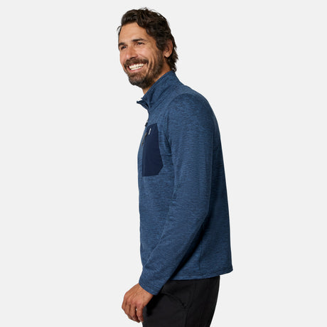 [Model is wearing size M.] A man wearing a heathered blue long-sleeve quarter-zip pullover with a solid dark blue chest pocket, shown in profile against a light gray studio background.