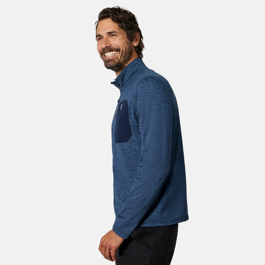[Model is wearing size M.] A man wearing a heathered blue long-sleeve quarter-zip pullover with a solid dark blue chest pocket, shown in profile against a light gray studio background.