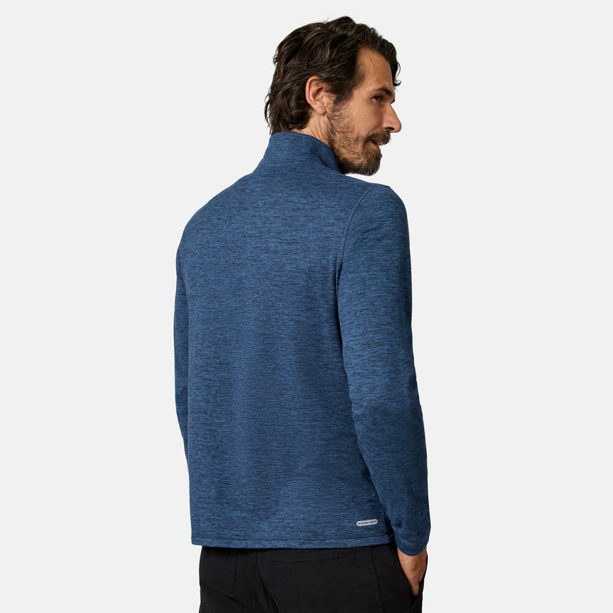 [Model is wearing size M.] A man wearing a heathered blue quarter-zip pullover jacket, shown from a three-quarters back view against a light gray studio background.