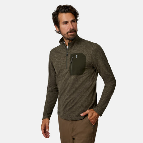 [Model is wearing size M.] A man wearing a dark olive green heathered quarter-zip pullover with a contrasting dark green chest pocket, paired with brown pants, against a light gray background.