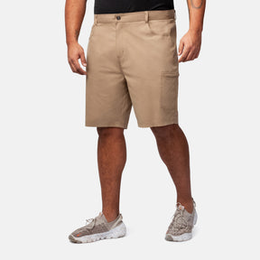 A person in Clearance Men's Stretch Active Poplin Trek Cargo Shorts, a black shirt, and light sneakers stands against a plain white background. The shorts are breathable, have a side pocket, and fall just above the knee.