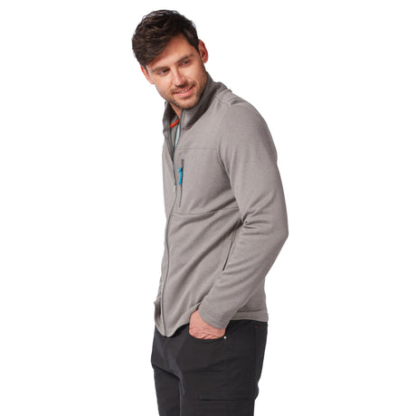 Man wearing a grey Men’s FreeCycle® Double Knit Full Zip Fleece Jacket with a small zippered chest pocket, looking to the side with his hands in his pockets.