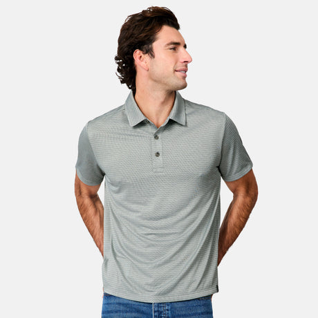 [Jacob is 6’1.5" wearing size M] Man wearing a gray striped polo shirt and blue jeans on a white background