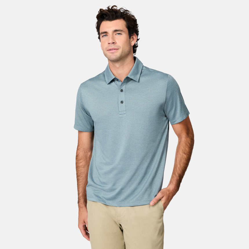 [Jacob is 6’1.5" wearing size M] Man wearing a light blue striped polo shirt on a white background