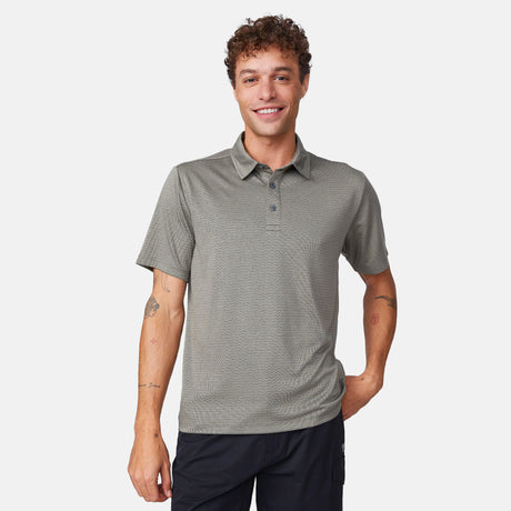 [Model is 6’1" wearing size M] Man wearing a green polo shirt on a white background