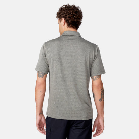 [Model is 6’1" wearing size M] Back view of man wearing a green polo shirt on a white background