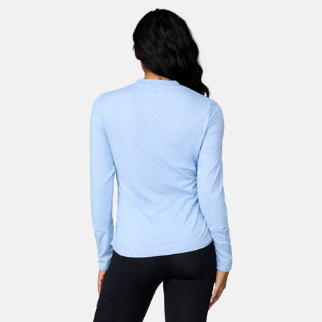 [Angelique is 5’10" wearing a size Small.] Woman wearing Free Country Women's Cloud Knit Crew Neck Top in Cloud, size S, made from Breathable stretch performance fabric featuring a sueded finish and soft hand feel, styled with black leggings