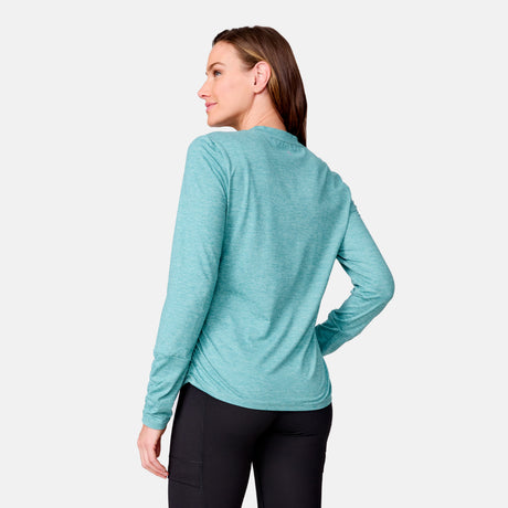 [Emily is 5’9” wearing a size Small.] Woman wearing Free Country Women's Cloud Knit Crew Neck Top in Laurel, size S, made from Breathable stretch performance fabric featuring a sueded finish and soft hand feel, styled with black leggings
