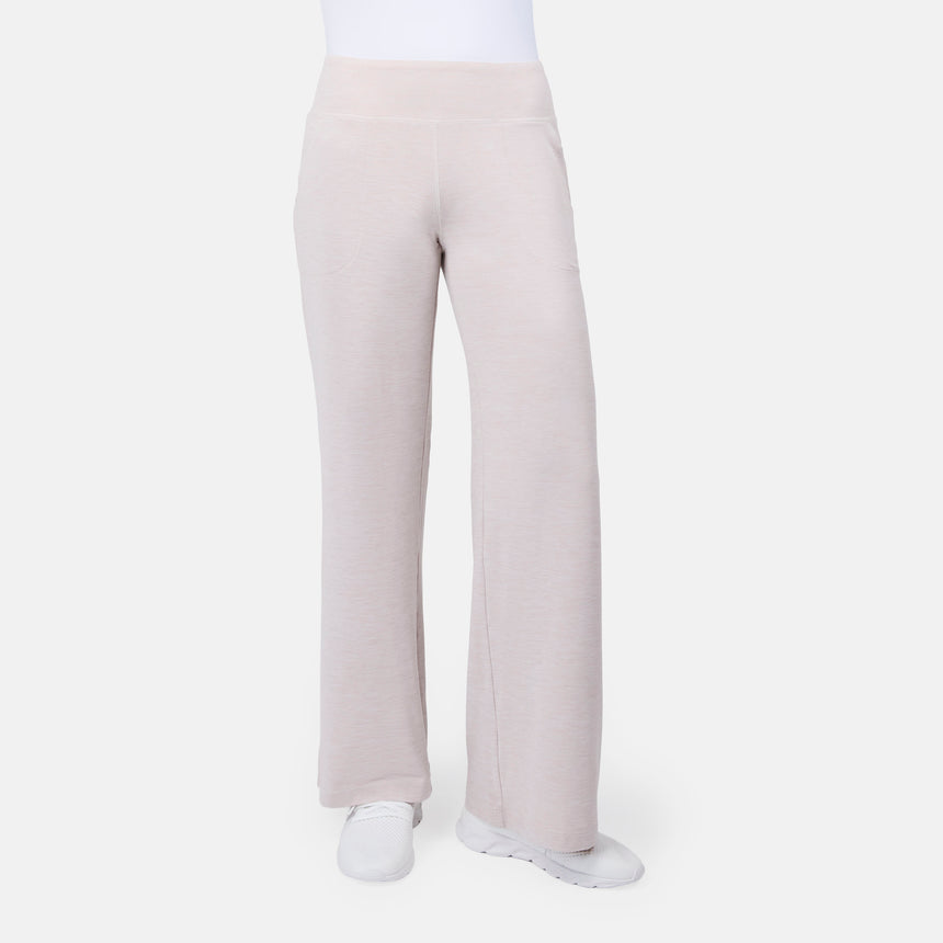 [Model is wearing size S] Light tan wide-leg pants worn by a person on a white background