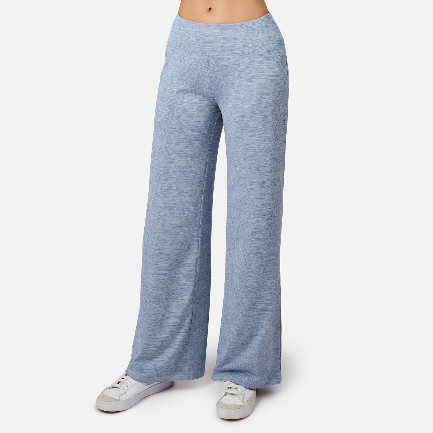Woman in dusk Women’s Cloud Knit Wide Leg Pants by Free Country and white sneakers, standing against a plain white backdrop. The cropped photo emphasizes the comfy pants and stylish shoes.
